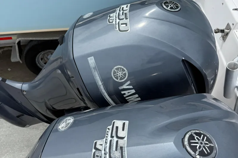 Slide: The Image of Twin Yamaha 250 HP outboard engines on a 2001 Grady-White Marlin 300 boat. - 26