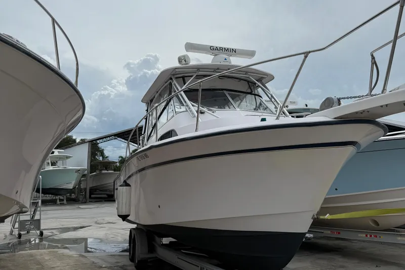 Slide: The Image of 2001 Grady-White Marlin 300 boat on trailer, equipped with Garmin radar. - 5