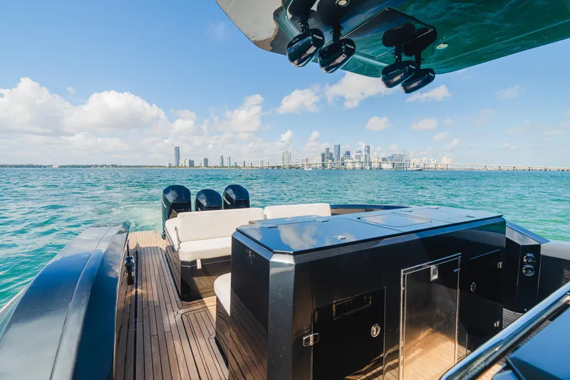 Slide: The Image of 2023 Pirelli Tecnorib 50 yacht on water with city skyline in background. - 22