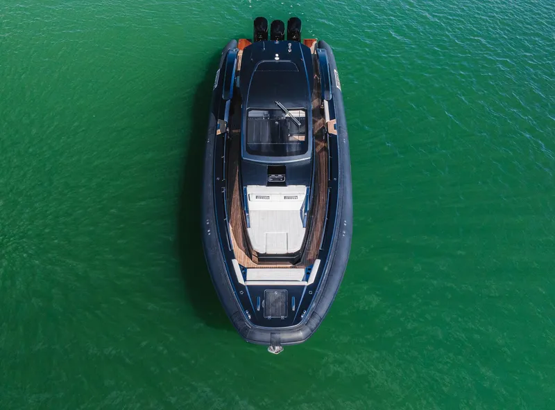 Slide: The Image of 2023 Pirelli Tecnorib 50 boat on clear green water, aerial view. - 37