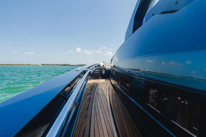 Slide: The Image of 2023 Pirelli Tecnorib 50 yacht on open water, showcasing sleek design and wooden deck. - 47