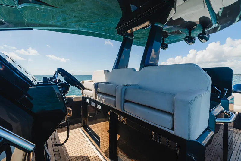Slide: The Image of 2023 Pirelli Tecnorib 50 yacht interior with modern seating and ocean view. - 48
