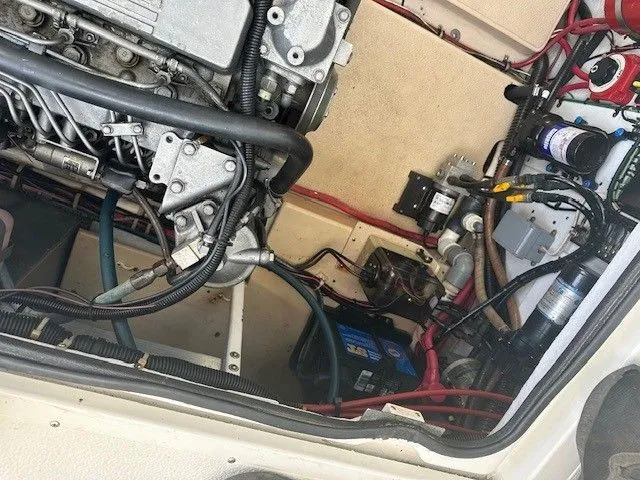 Slide: The Image of Engine compartment of a 1987 Shamrock 31 GS boat, showing detailed wiring and components. - 17