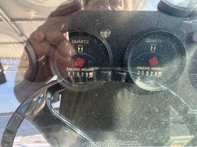 Slide: The Image of 1987 Shamrock 31 GS engine hour meters showing 1039 and 1028 hours. - 9