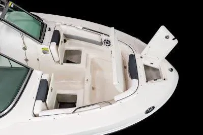 Slide: The Image of 2026 Robalo R207 Dual Console boat interior with white seating and speakers. - 3