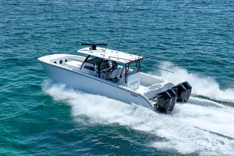 Slide: The Image of 2026 Invincible 40 Catamaran cruising on open water, showcasing powerful engines and sleek design. - 0