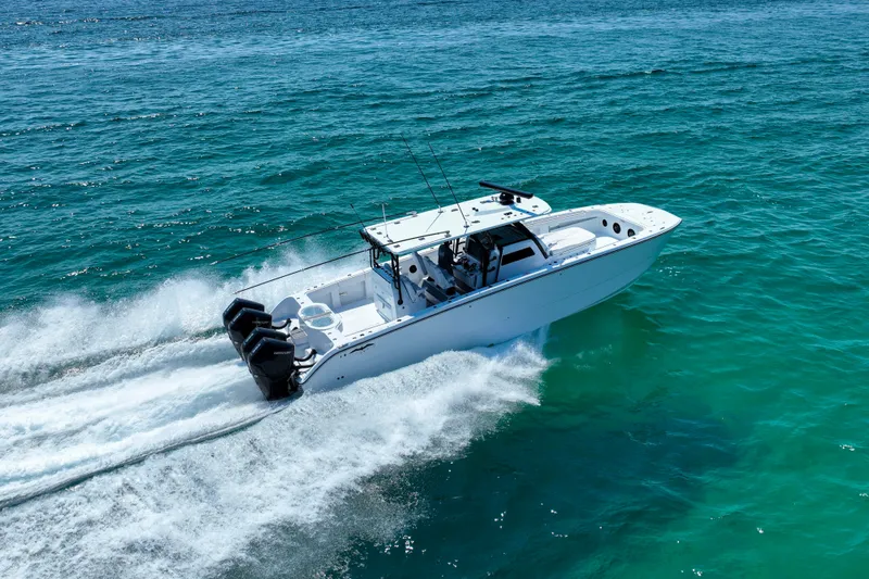 Slide: The Image of 2026 Invincible 40 Catamaran cruising on clear blue ocean waters. - 2