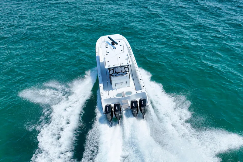 Slide: The Image of Invincible 40 Catamaran 2026 cruising on open water, aerial view. - 45