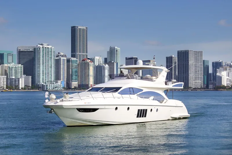 The Image of Luxurious 2011 Azimut 70 yacht cruising near a city skyline. - 0