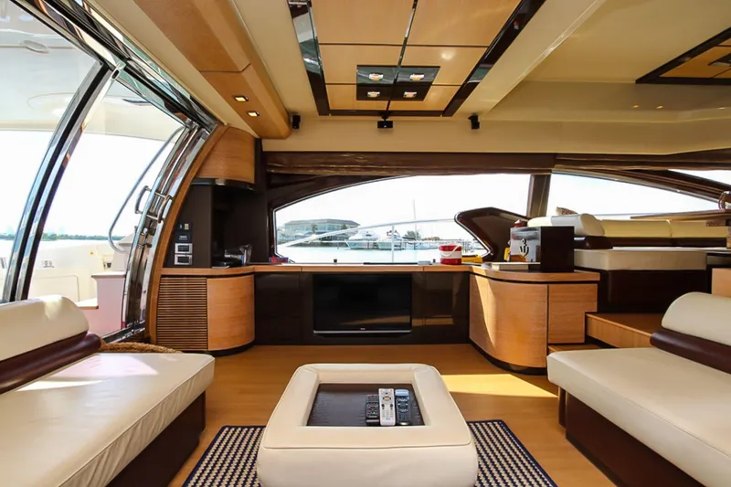 Slide: The Image of Luxurious interior of a 2011 Azimut 70 yacht with modern furnishings and panoramic windows. - 12
