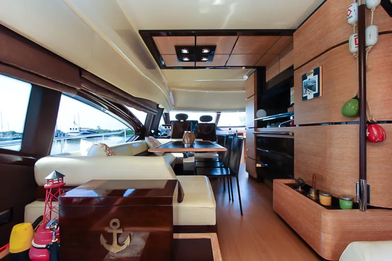 Slide: The Image of Luxurious interior of a 2011 Azimut 70 yacht with modern furnishings and elegant design. - 13