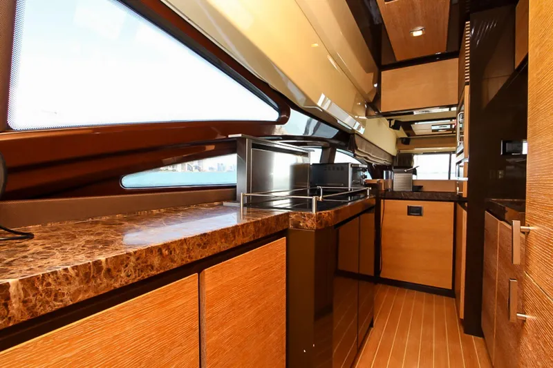 Slide: The Image of Luxurious interior of a 2011 Azimut 70 yacht with sleek wood finishes and modern design. - 17