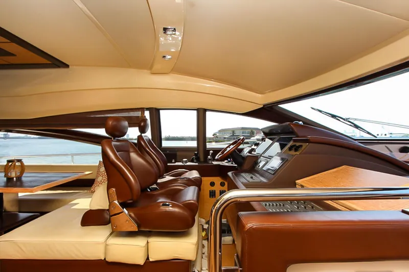 Slide: The Image of Luxurious interior of a 2011 Azimut 70 yacht with leather seating and modern dashboard. - 18