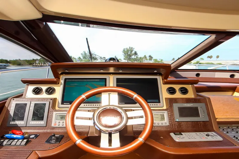 Slide: The Image of Helm of 2011 Azimut 70 yacht with modern navigation equipment and wooden steering wheel. - 20