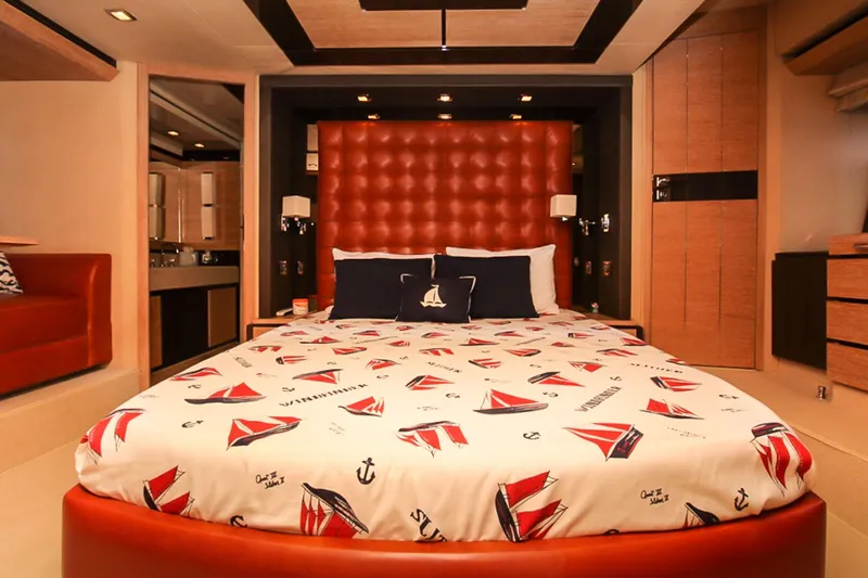 Slide: The Image of Luxurious bedroom interior on 2011 Azimut 70 yacht with nautical-themed bedding. - 21
