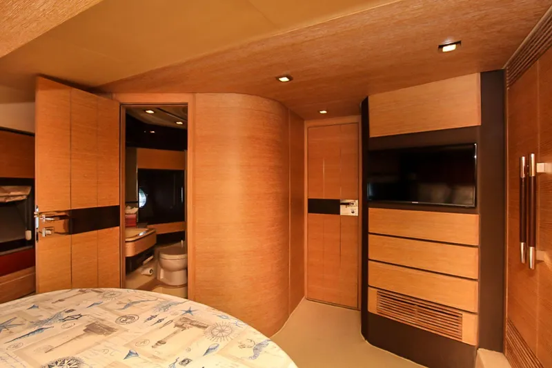 Slide: The Image of Luxurious interior of 2011 Azimut 70 yacht with modern wood finishes and built-in amenities. - 24