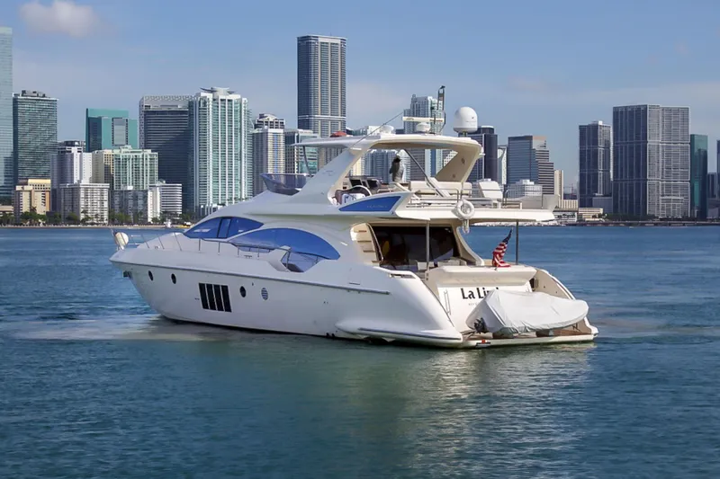 Slide: The Image of Luxury 2011 Azimut 70 yacht cruising near city skyline. - 3