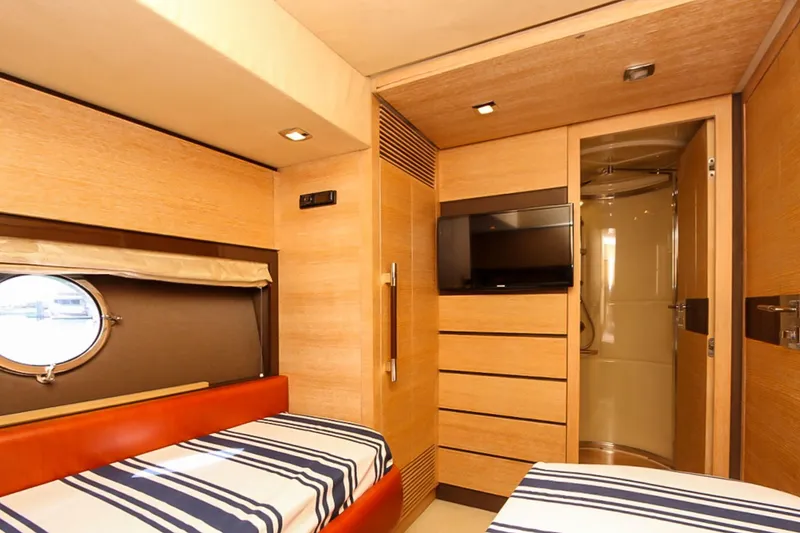 Slide: The Image of Luxurious cabin interior of 2011 Azimut 70 yacht with twin beds and modern amenities. - 32