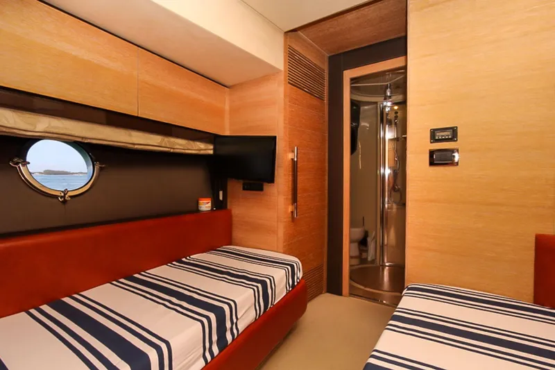 Slide: The Image of Luxurious cabin interior of 2011 Azimut 70 yacht with twin beds and modern amenities. - 35