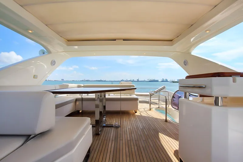 Slide: The Image of Luxurious 2011 Azimut 70 yacht deck with seating, ocean view, and elegant design. - 41