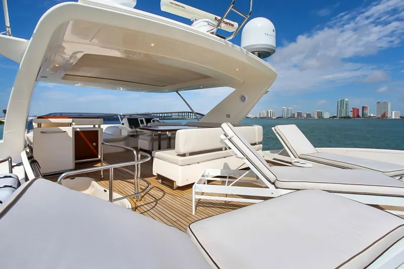 Slide: The Image of Luxurious 2011 Azimut 70 yacht deck with sun loungers and ocean view. - 42