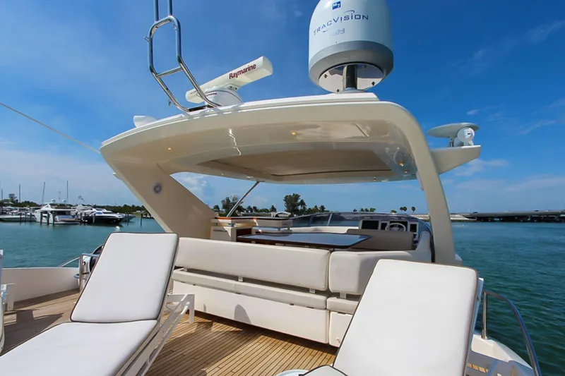 Slide: The Image of Luxury Azimut 70 yacht deck with seating, 2011 model, under clear blue sky. - 44