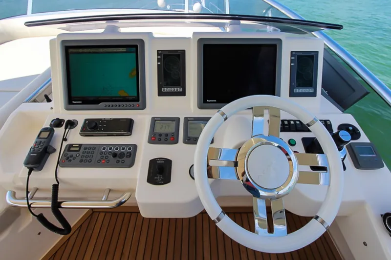 Slide: The Image of Cockpit of 2011 Azimut 70 yacht with modern navigation equipment and steering wheel. - 47