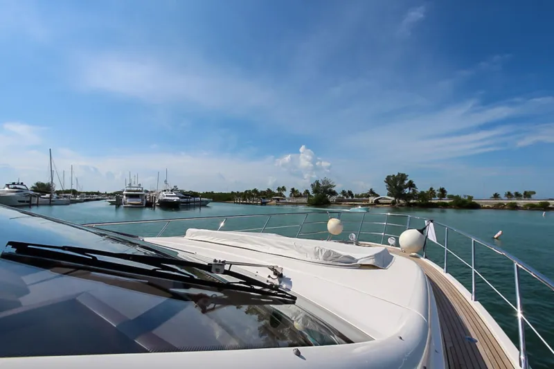 Slide: The Image of Azimut 70 yacht cruising in a serene marina under a clear blue sky, 2011 model. - 48