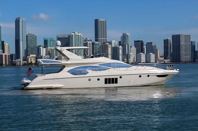 Slide: The Image of Luxury 2011 Azimut 70 yacht cruising near city skyline. - 5