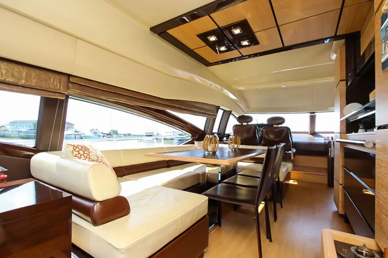 Slide: The Image of Luxurious interior of 2011 Azimut 70 yacht with elegant seating and dining area. - 9