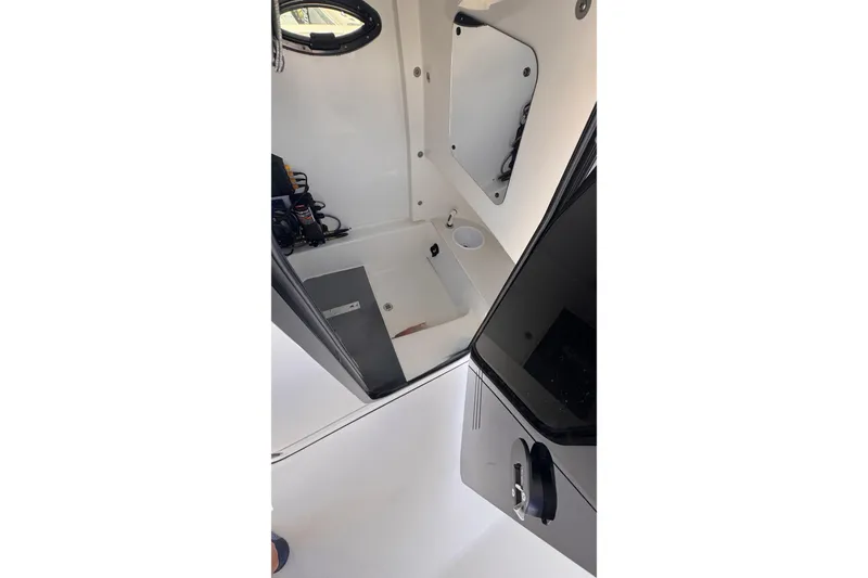Slide: The Image of Interior view of 2024 Sea Pro 242 boat cabin with modern amenities. - 17