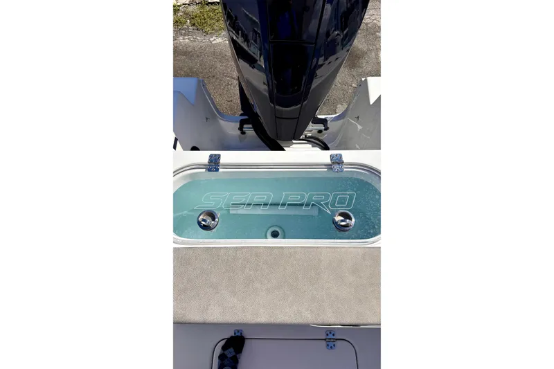 Slide: The Image of 2024 Sea Pro 242 boat livewell with logo, showcasing sleek design and functionality. - 21