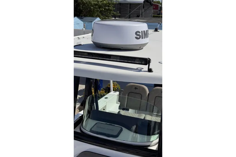Slide: The Image of 2024 Sea Pro 242 boat with Simrad radar on the roof. - 23
