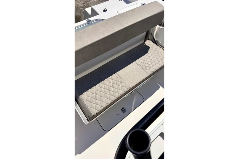 Slide: The Image of 2024 Sea Pro 242 boat seat with quilted upholstery and storage compartment. - 24