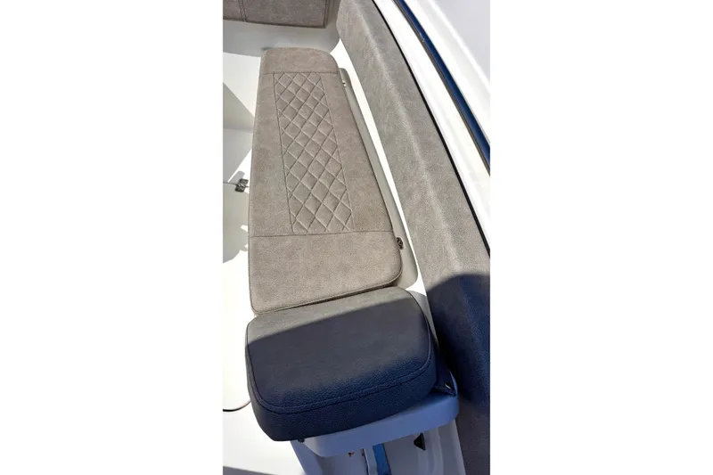 Slide: The Image of 2024 Sea Pro 242 boat seat with diamond-patterned upholstery and sleek design. - 9
