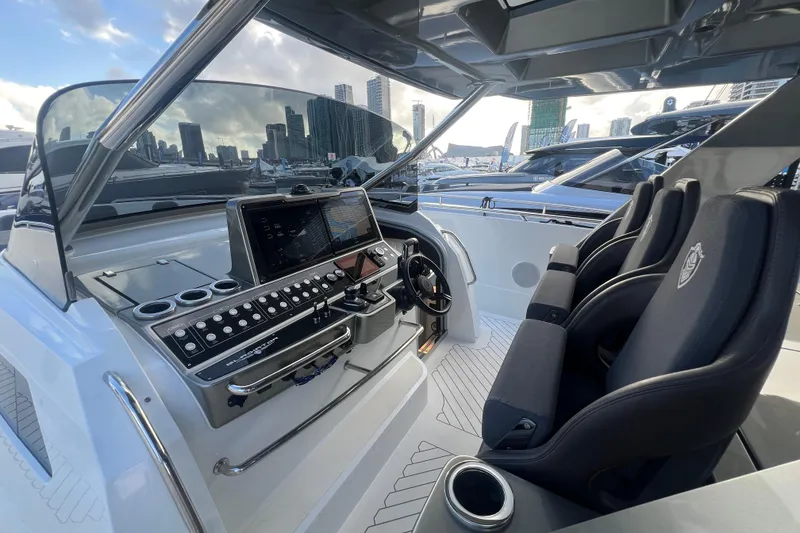Slide: The Image of 2023 Canados 493 Gladiator yacht cockpit with modern controls and luxurious seating. - 12