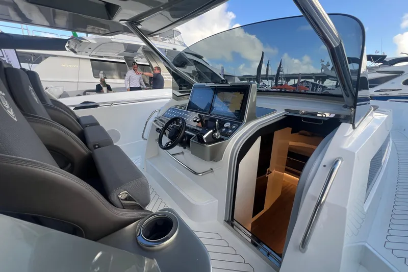 Slide: The Image of 2023 Canados 493 Gladiator yacht cockpit with modern controls and luxurious seating. - 16