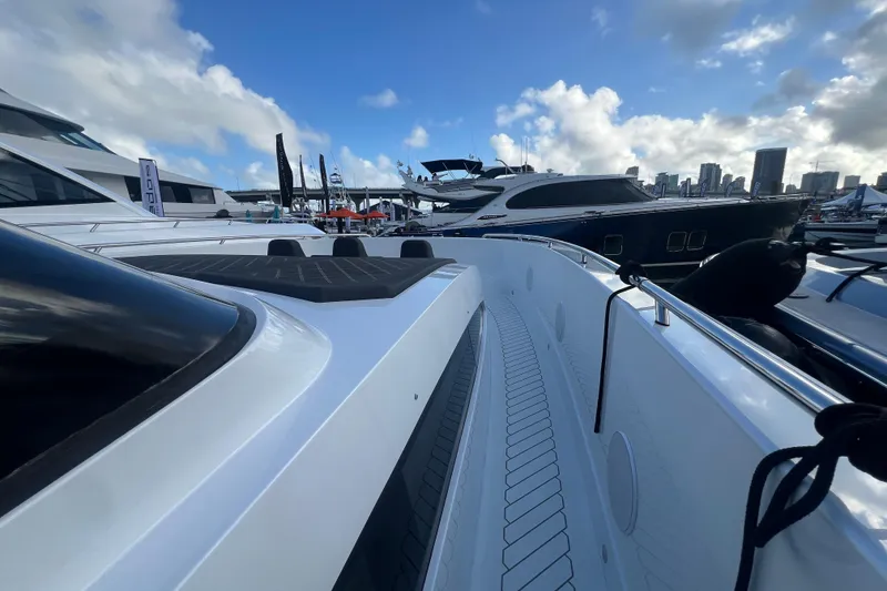 Slide: The Image of 2023 Canados 493 Gladiator yacht docked at marina under blue sky. - 17
