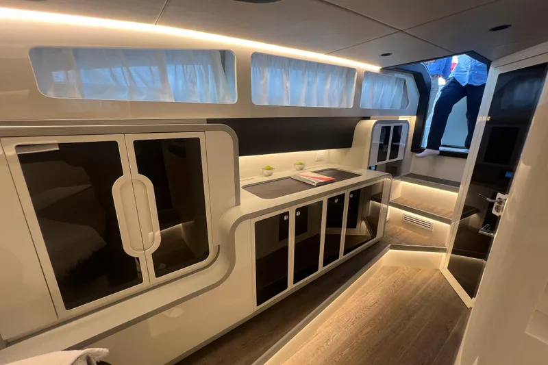 Slide: The Image of Luxurious interior of 2023 Canados 493 Gladiator yacht with modern cabinetry and ambient lighting. - 27