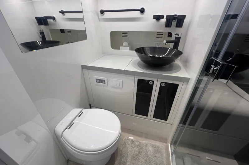 Slide: The Image of Modern bathroom in 2023 Canados 493 Gladiator yacht with sleek fixtures and elegant design. - 28