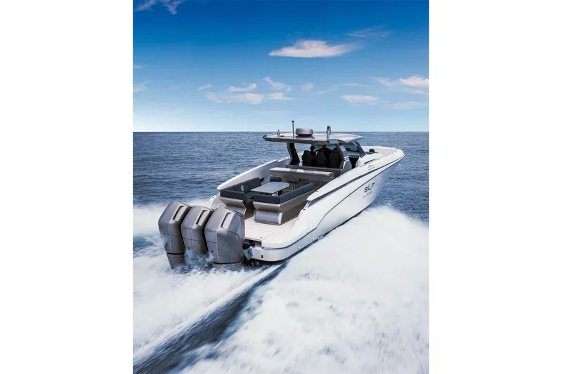 Slide: The Image of 2023 Canados 493 Gladiator yacht cruising on open sea, showcasing powerful engines. - 3