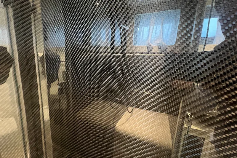 Slide: The Image of Carbon fiber interior of 2023 Canados 493 Gladiator yacht, showcasing modern design elements. - 31