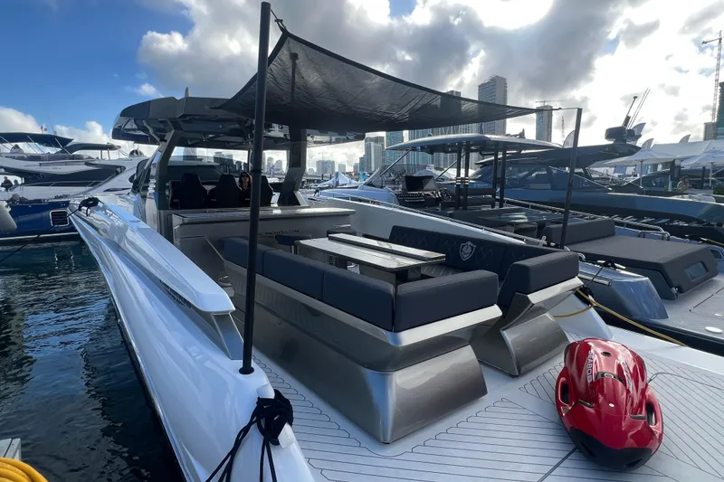 Slide: The Image of 2023 Canados 493 Gladiator yacht docked, featuring sleek design and modern amenities. - 4