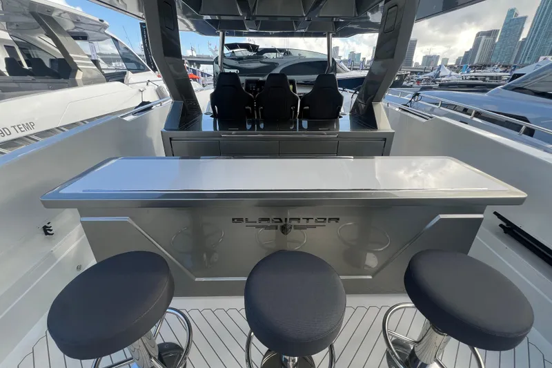 Slide: The Image of 2023 Canados 493 Gladiator yacht interior with sleek bar and seating. - 7