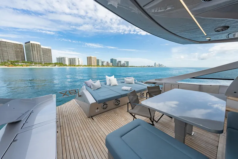 Slide: The Image of Luxurious 2021 Pershing 9X yacht deck with ocean view and city skyline. - 11