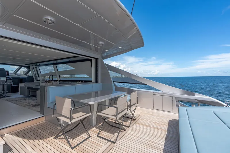 Slide: The Image of Luxurious 2021 Pershing 9X yacht deck with ocean view and modern seating area. - 14