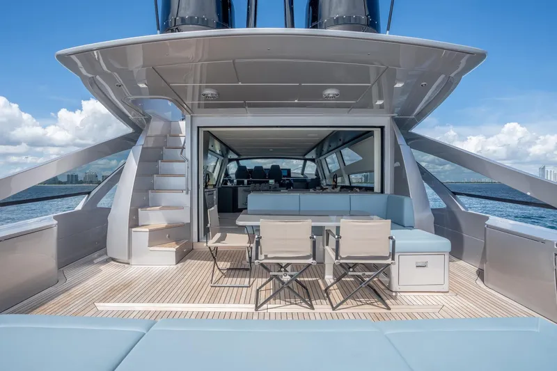Slide: The Image of Luxurious 2021 Pershing 9X yacht deck with seating, ocean view, and modern design. - 15
