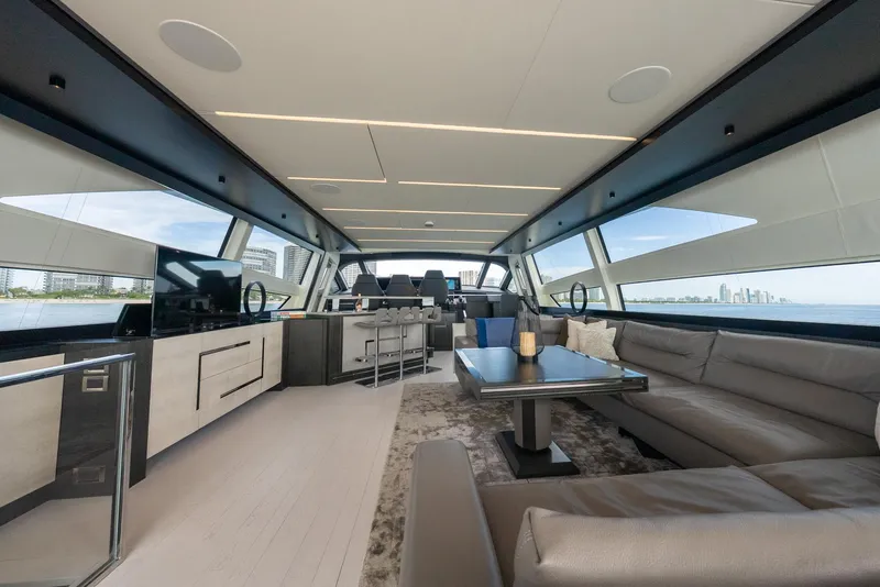 Slide: The Image of Luxurious interior of 2021 Pershing 9X yacht with modern furnishings and panoramic windows. - 16
