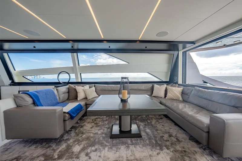 Slide: The Image of Luxurious interior of 2021 Pershing 9X yacht with modern seating and ocean view. - 17