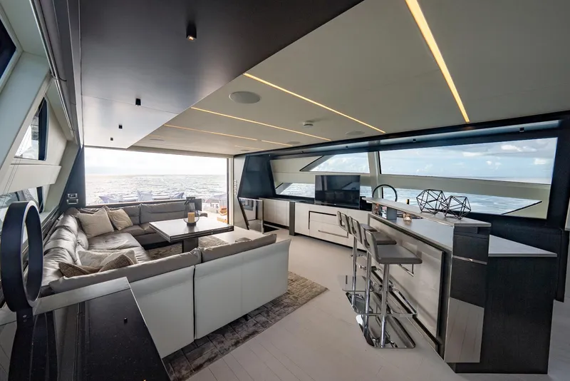 Slide: The Image of Luxurious interior of 2021 Pershing 9X yacht with modern seating and ocean view. - 19